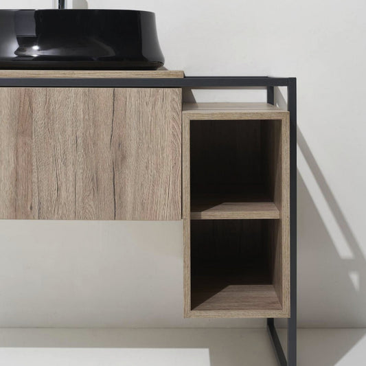 schwarzes Waschbecken auf Unterschrank, helles Holz, rechts zwei Fächer übereinander, schwarzer Metalrahmen